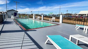 Seasonal outdoor pool, open 7:00 AM to 9:00 PM, sun loungers