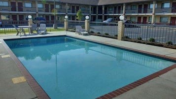 Seasonal outdoor pool, open 7:00 AM to 9:00 PM, pool loungers