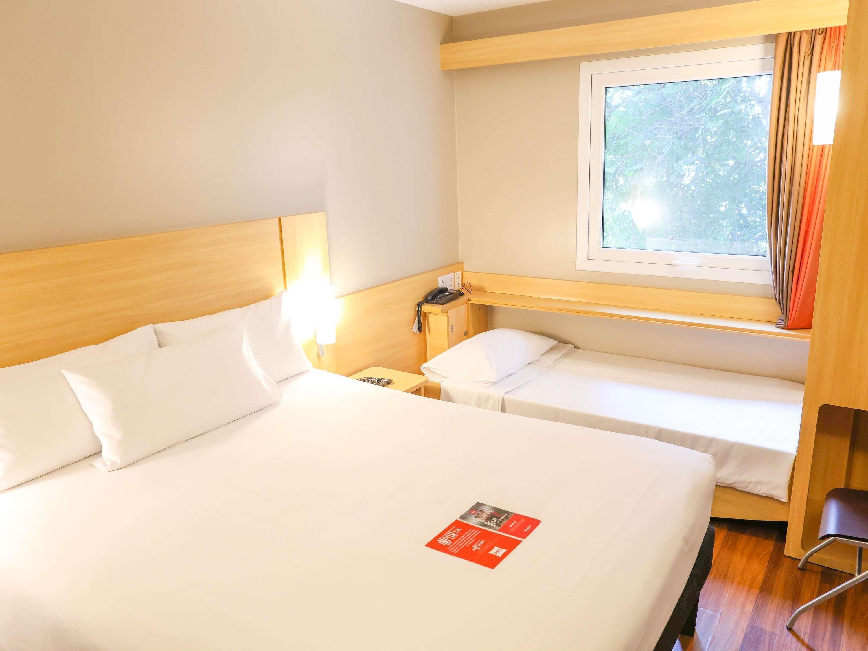 Standard Room, Multiple Beds | In-room safe, desk, soundproofing, iron/ironing board