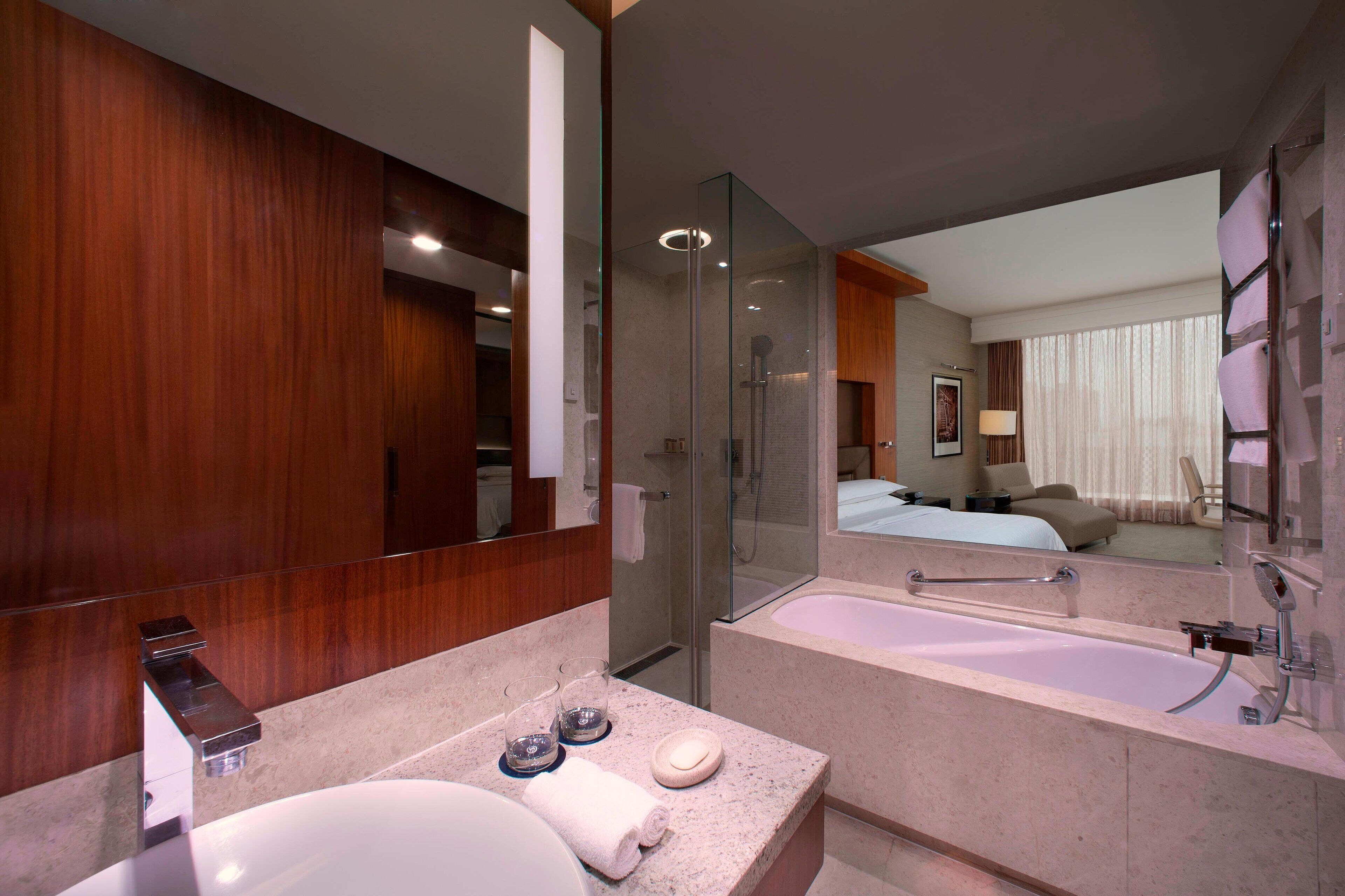 separate bathtub and shower, deep-soaking bathtub, rainfall showerhead