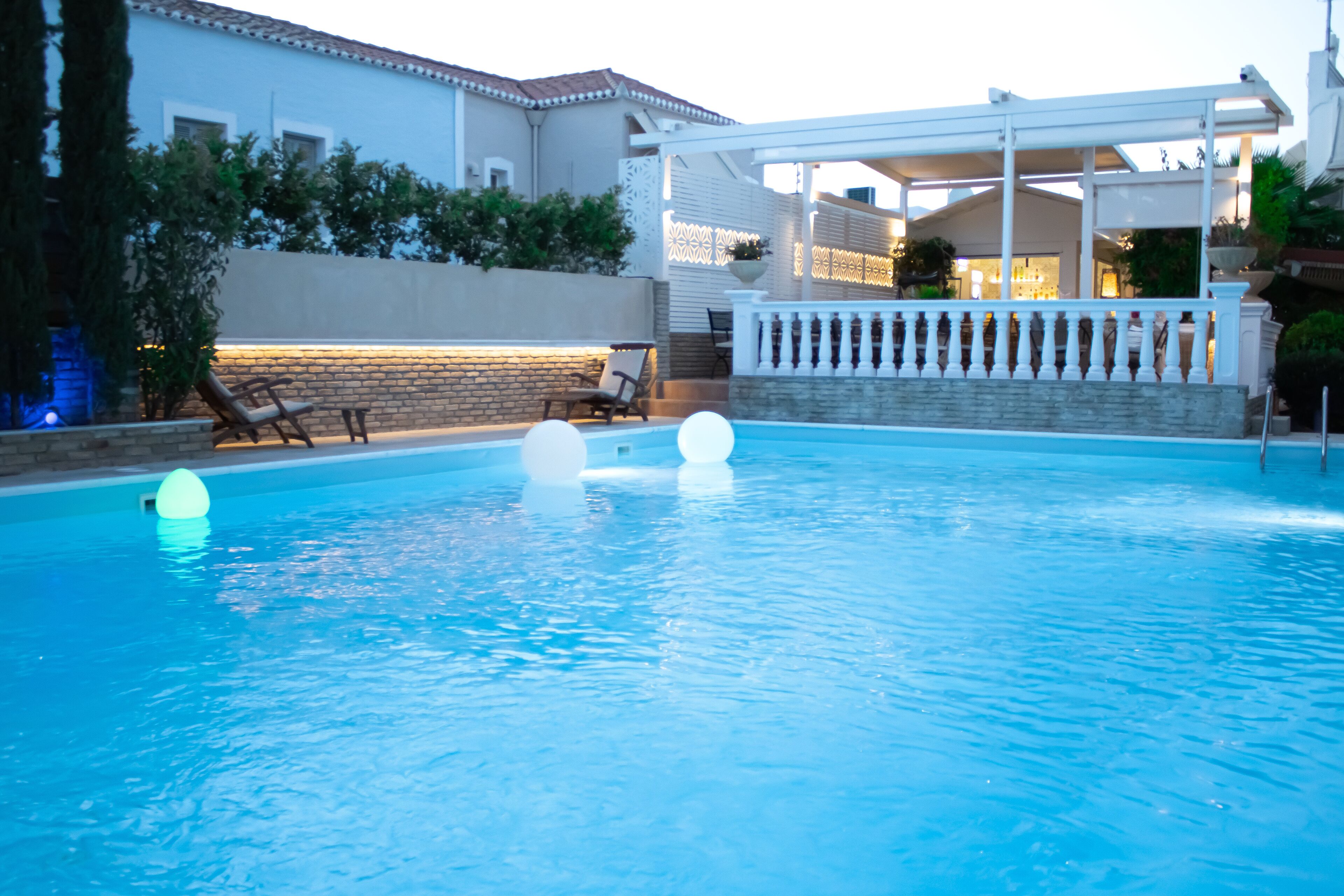 outdoor pool, pool loungers, lifeguards on site