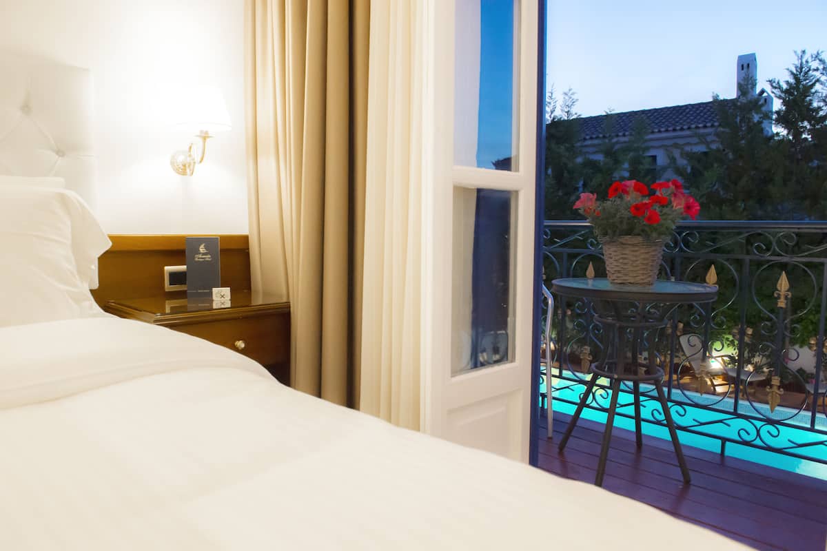 standard double room, pool view | premium bedding, minibar, in-room safe, desk