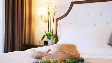 Ropa de cama de alta calidad, minibar, caja fuerte y escritorio