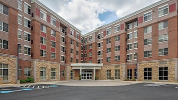 A multi-story brick building with a central entrance labeled "Residence Inn."
