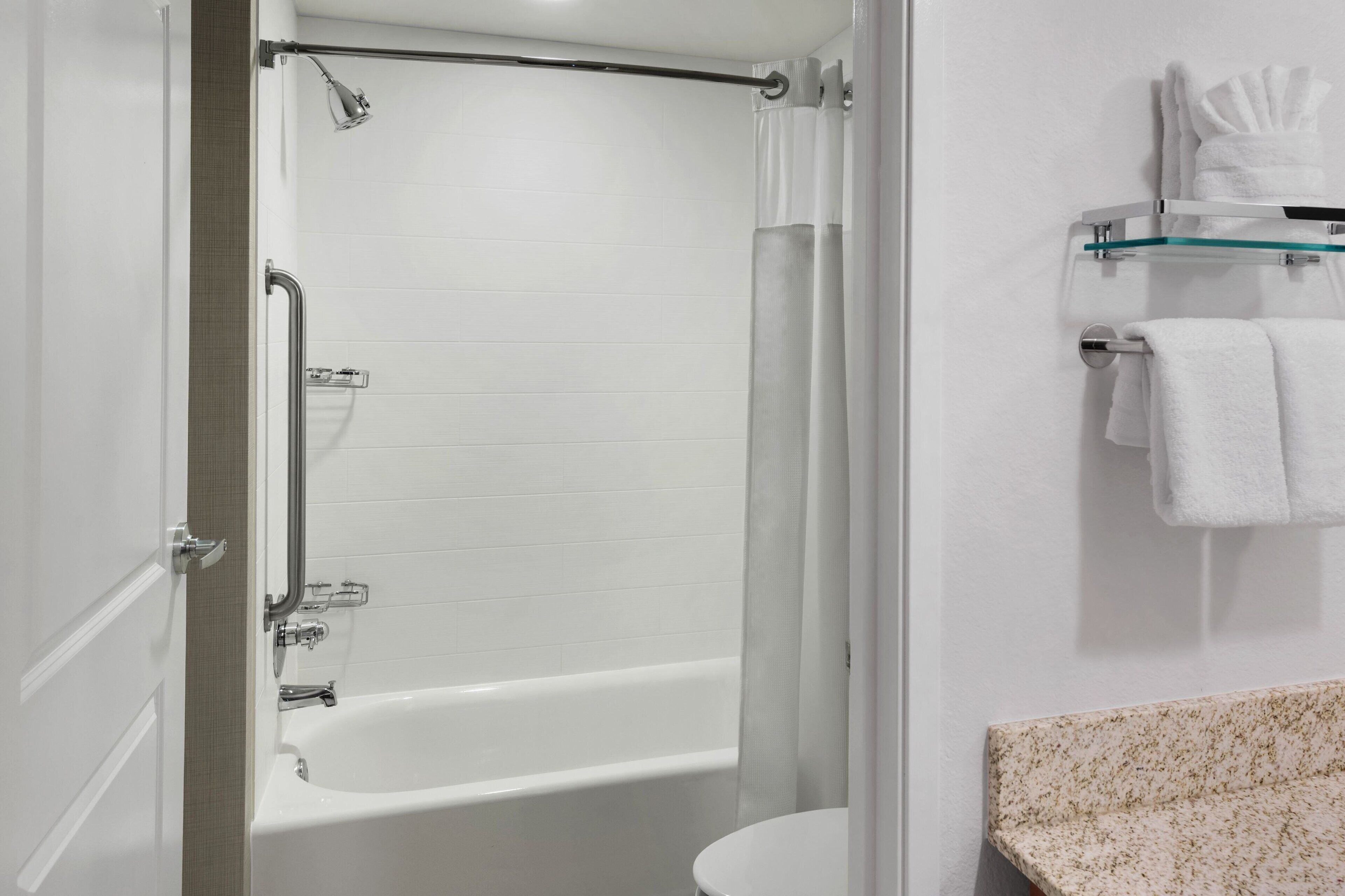 combined shower/bathtub, free toiletries, towels