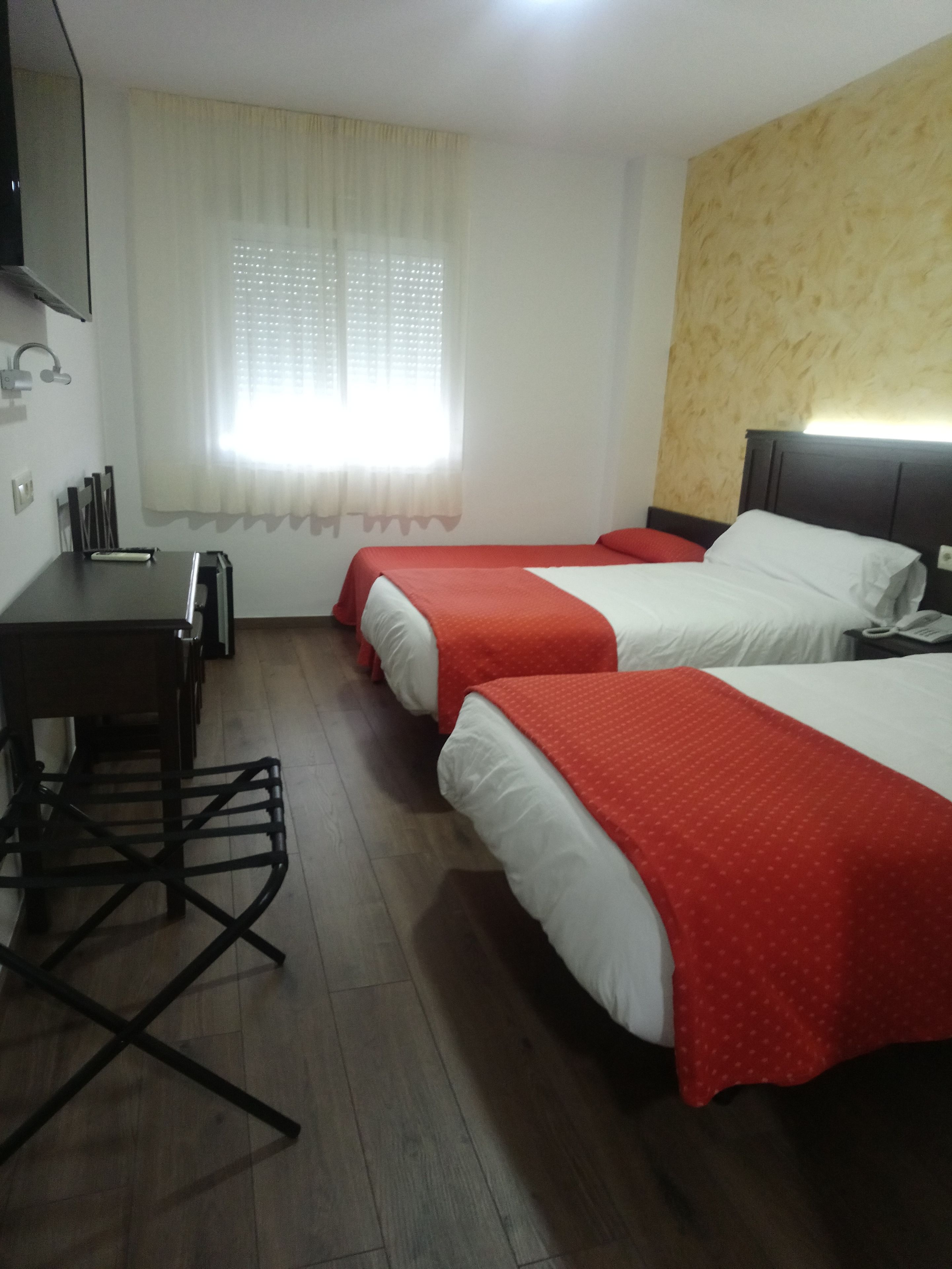 triple room | minibar, in-room safe, desk, blackout curtains