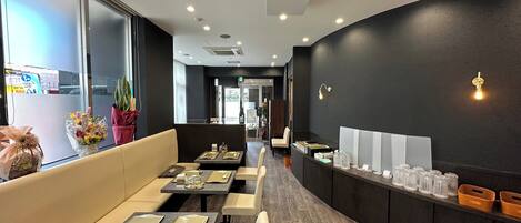 A restaurant interior with booths, tables, and a counter.