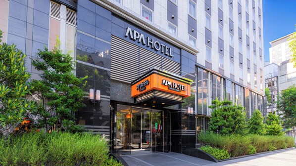 A modern building with a sign reading "APA HOTEL". - APA Hotel Nagoya Sakae (Nagoya)