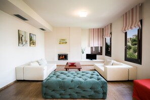 Family Apartment, 1 Bedroom, Annex Building | Living area | 32-inch flat-screen TV with satellite channels, TV, books