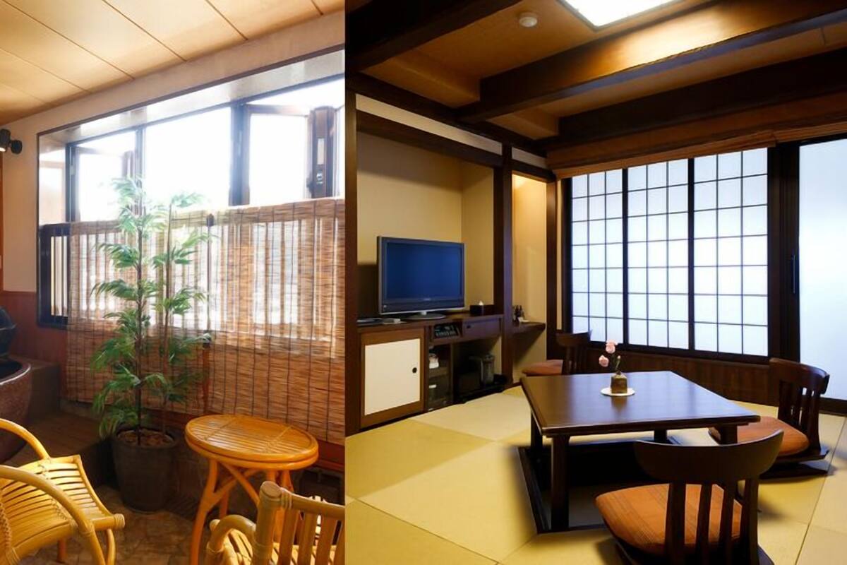 A traditional Japanese-style room with tatami flooring, a television, a potted plant, and a sliding door.