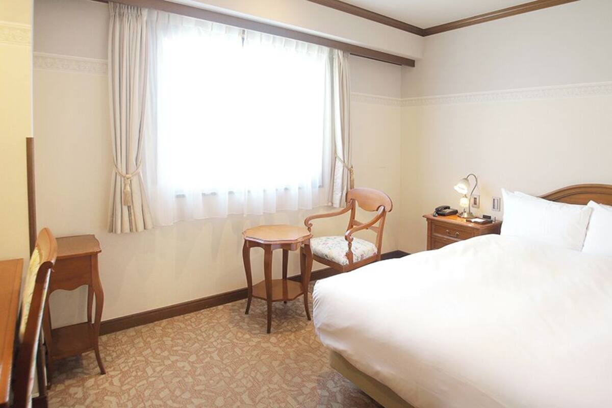 Premium bedding, down comforters, desk, iron/ironing board (on request)