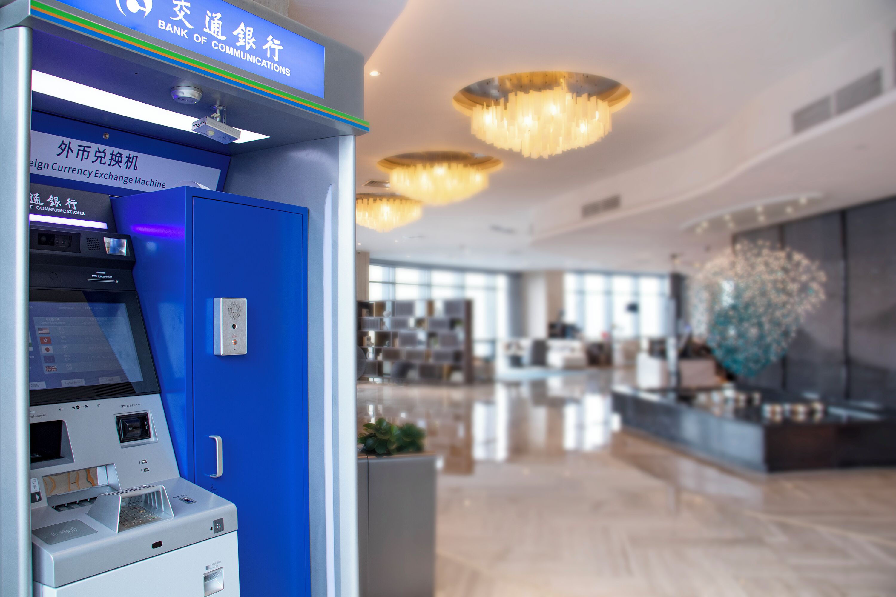 A modern bank with a blue currency exchange machine.
