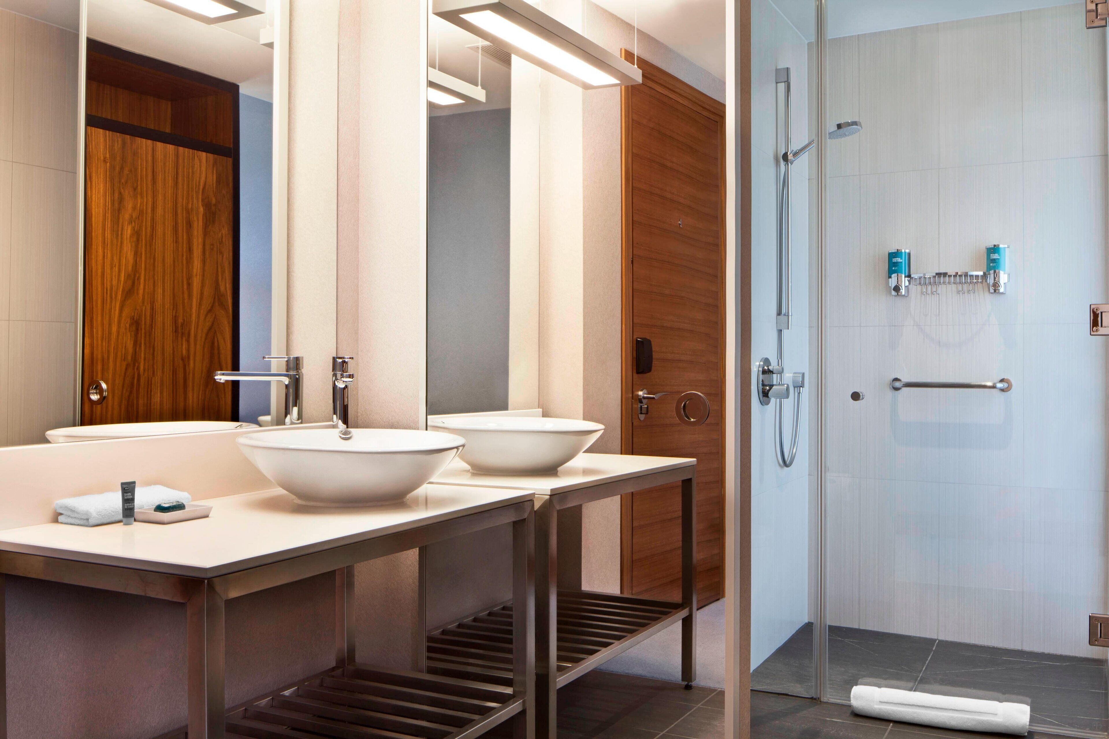 shower, rainfall showerhead, eco-friendly toiletries, towels