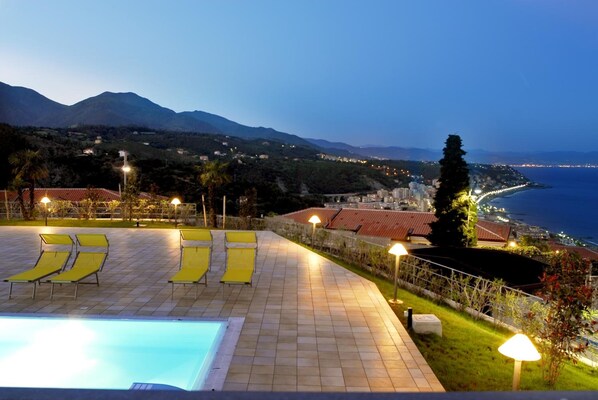 Outdoor pool, open 9 AM to 7:00 PM, pool umbrellas, pool loungers