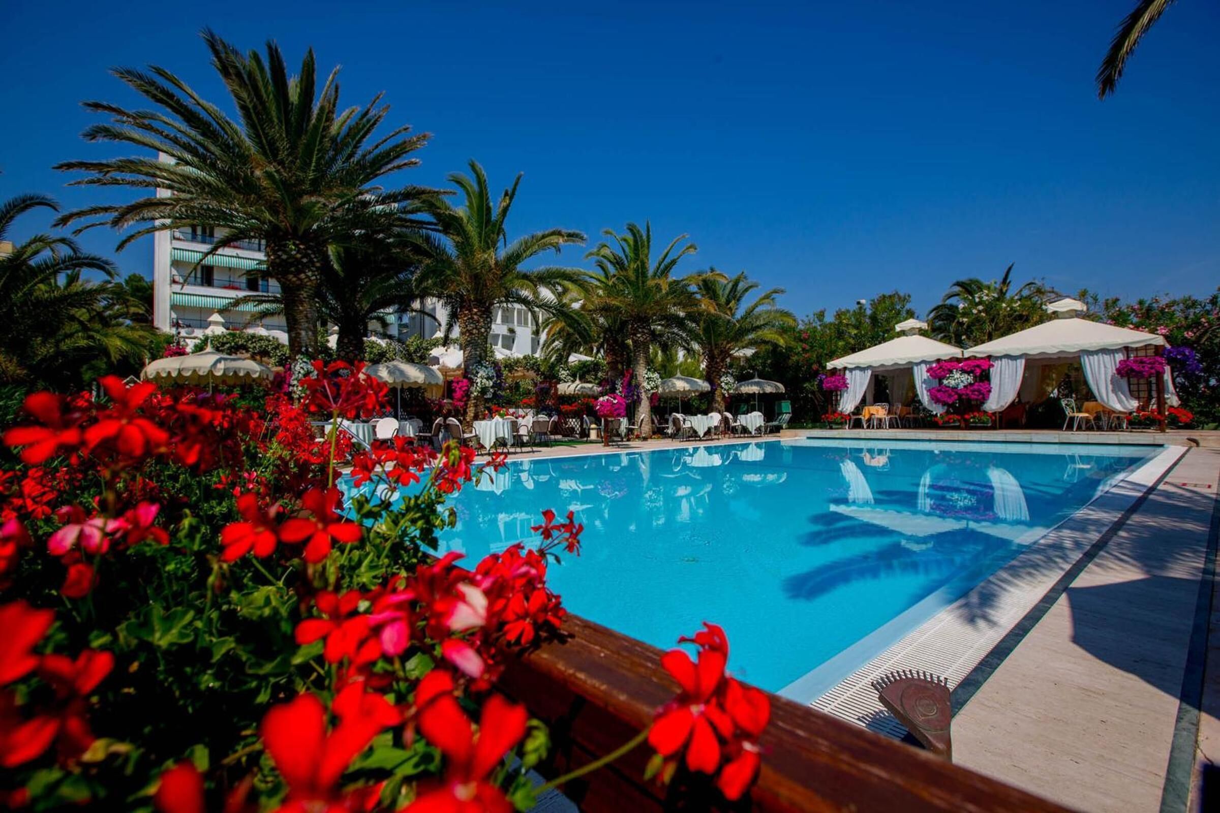 outdoor pool, pool umbrellas, pool loungers