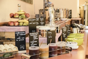 A breakfast buffet with various spreads and fruits. - JUFA Hotel Seckau (Seckau)