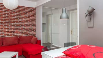 Standard Apartment, 1 Bedroom, Kitchen | Living area | 128-cm Smart TV with cable channels, TV