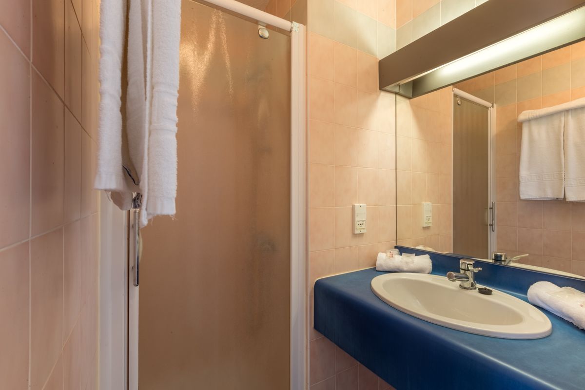triple room | bathroom | rainfall showerhead, free toiletries, hair dryer, towels