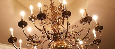 A chandelier with multiple candle-like lights.