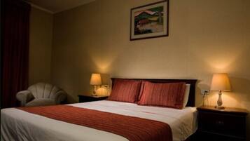 Desk, blackout drapes, iron/ironing board, rollaway beds