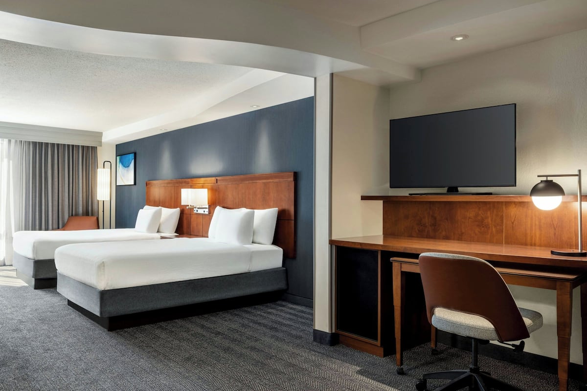 Desk, laptop workspace, blackout drapes, iron/ironing board