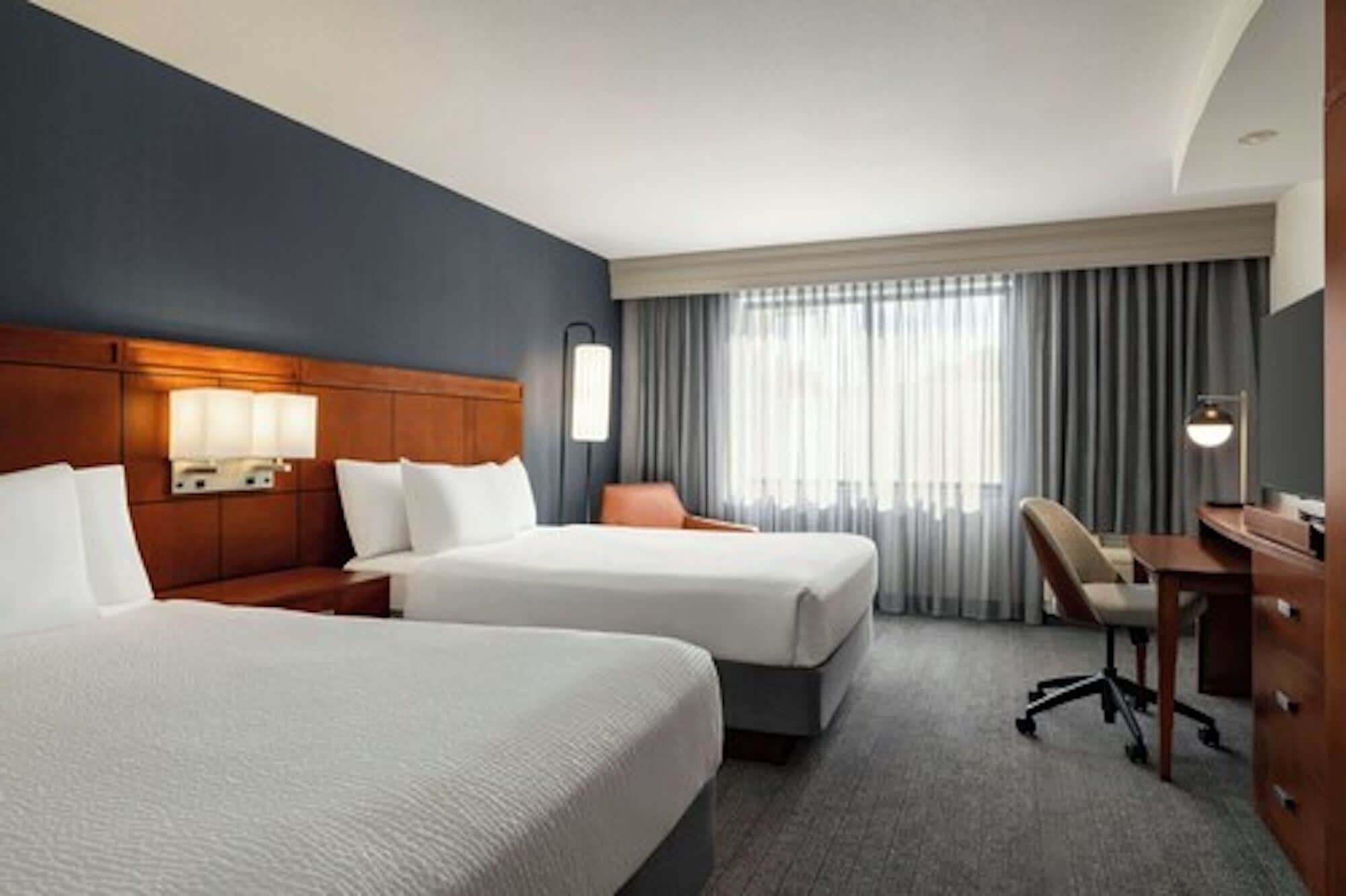 desk, laptop workspace, blackout curtains, iron/ironing board