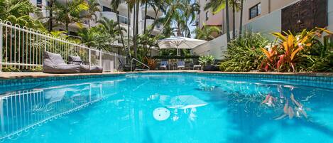 Outdoor pool, a heated pool, sun loungers