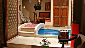 A traditional interior with a pool, seating area, and a staircase leading to an upper level. - Riad Sidi Mimoune (Marrakech)