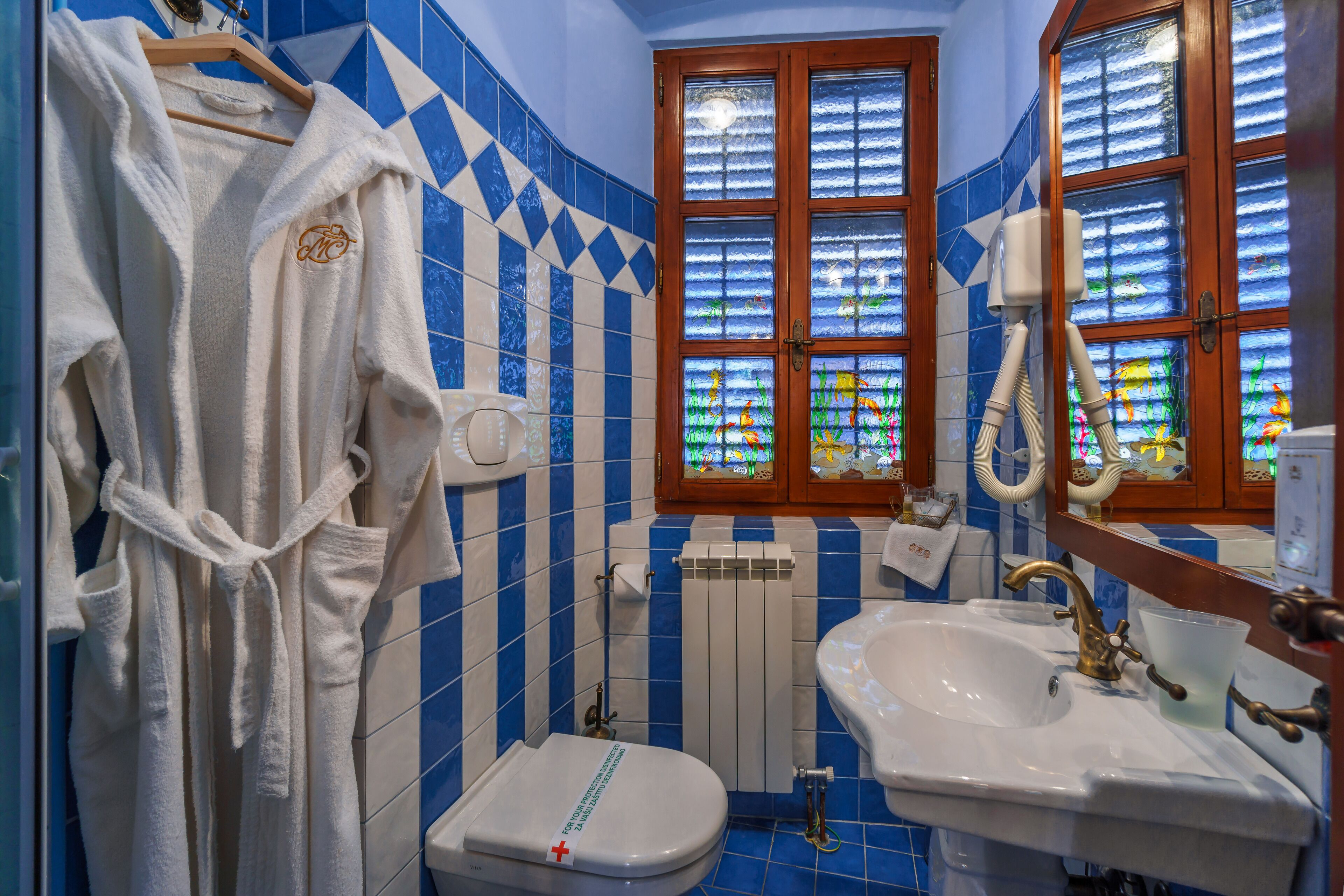 shower, hair dryer, slippers, towels