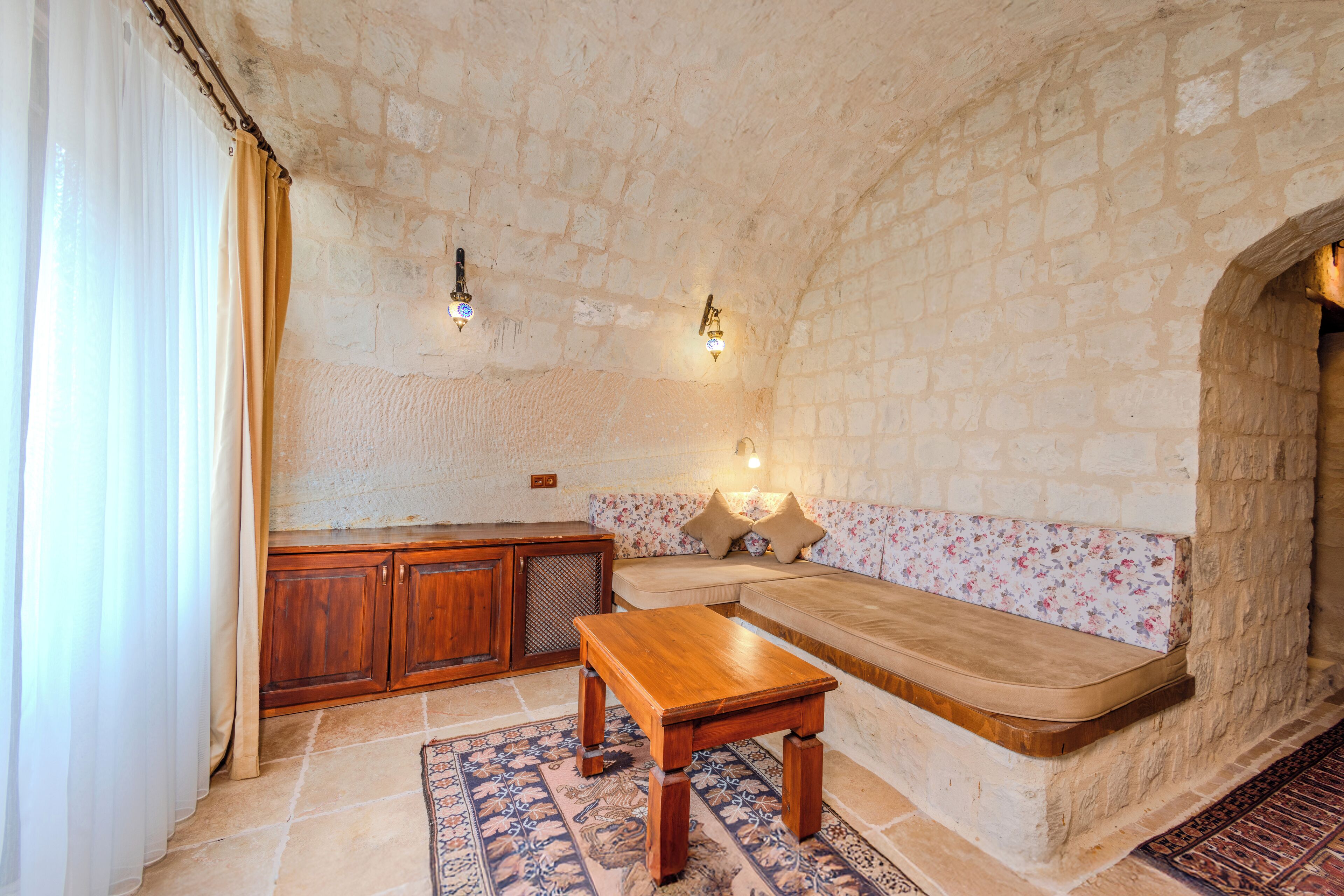 luxury cave suite | living area | 60-cm plasma tv with satellite channels, tv