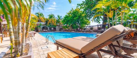 Outdoor pool, open 7:00 AM to 10:00 PM, sun loungers