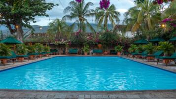 Outdoor pool, open 7:00 AM to 10:00 PM, pool loungers