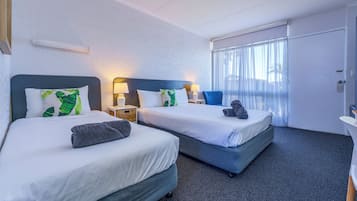 2 bedrooms, premium bedding, laptop workspace, blackout drapes
