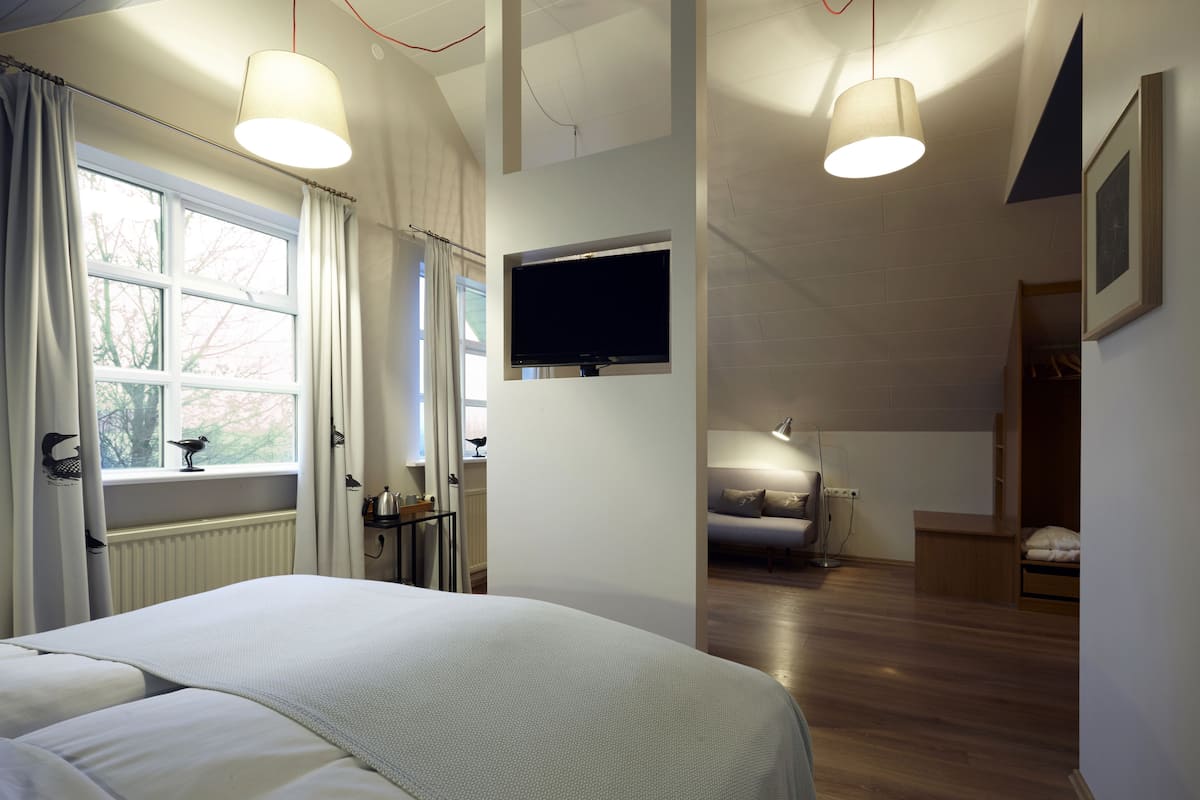 suite | hypo-allergenic bedding, down duvets, in-room safe, desk