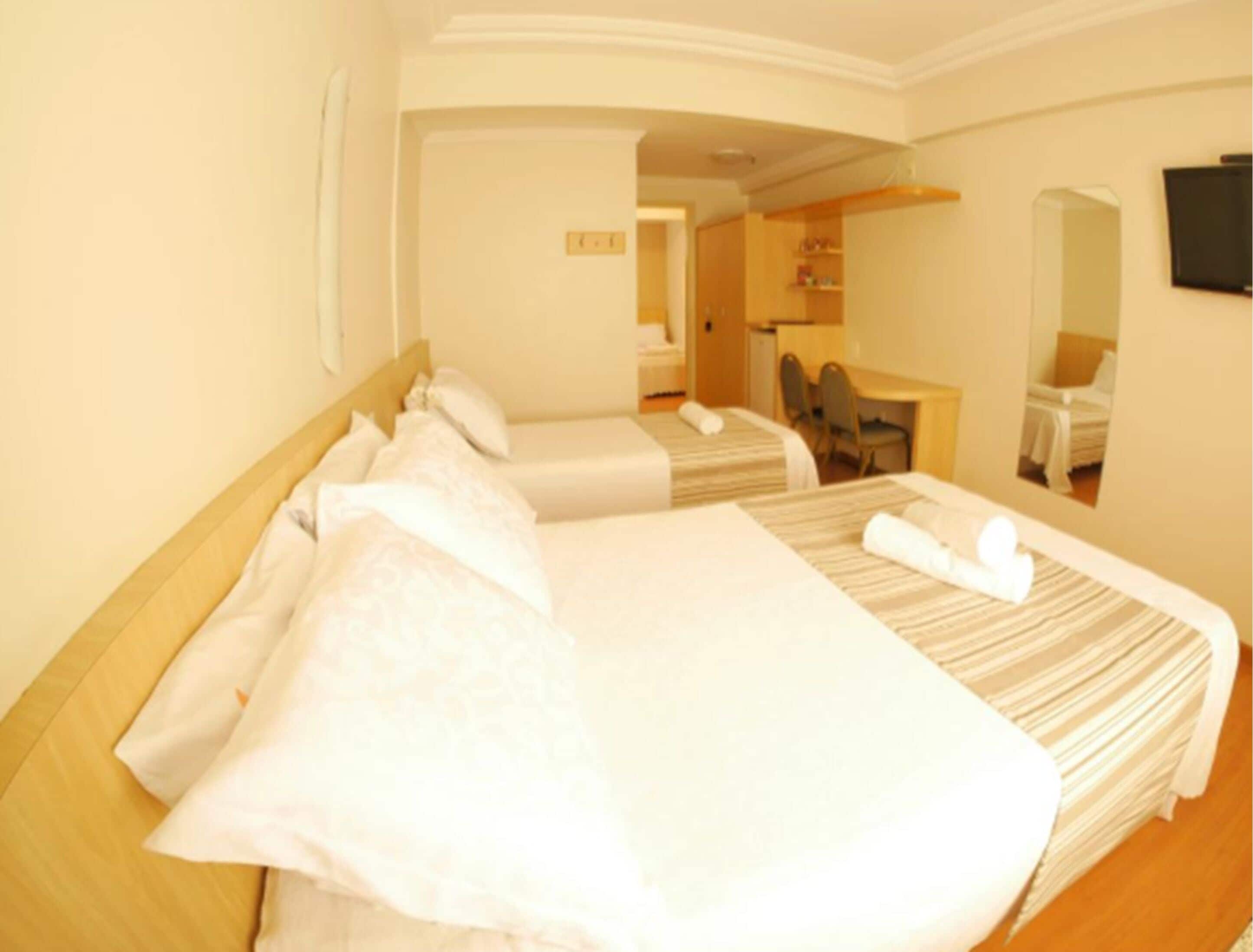 standard triple room | minibar, in-room safe, desk, blackout curtains