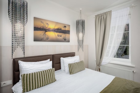 Deluxe Studio | Desk, laptop workspace, soundproofing, iron/ironing board