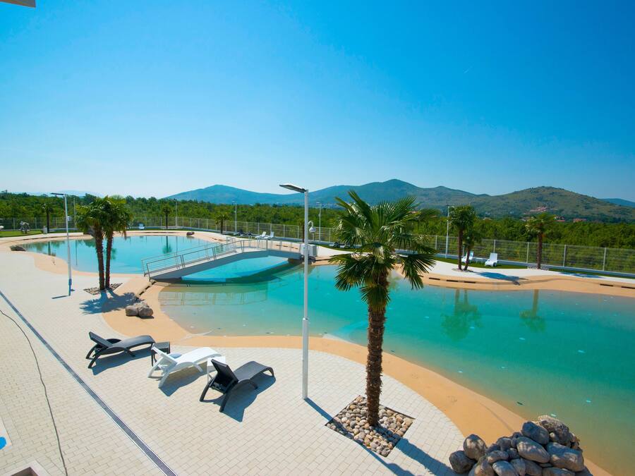 Seasonal outdoor pool, pool umbrellas, pool loungers