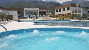 4 indoor pools, 3 outdoor pools, open 9 AM to 10 PM, pool umbrellas