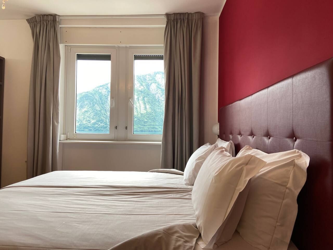 standard double room, lake view | minibar, in-room safe, desk, rollaway beds