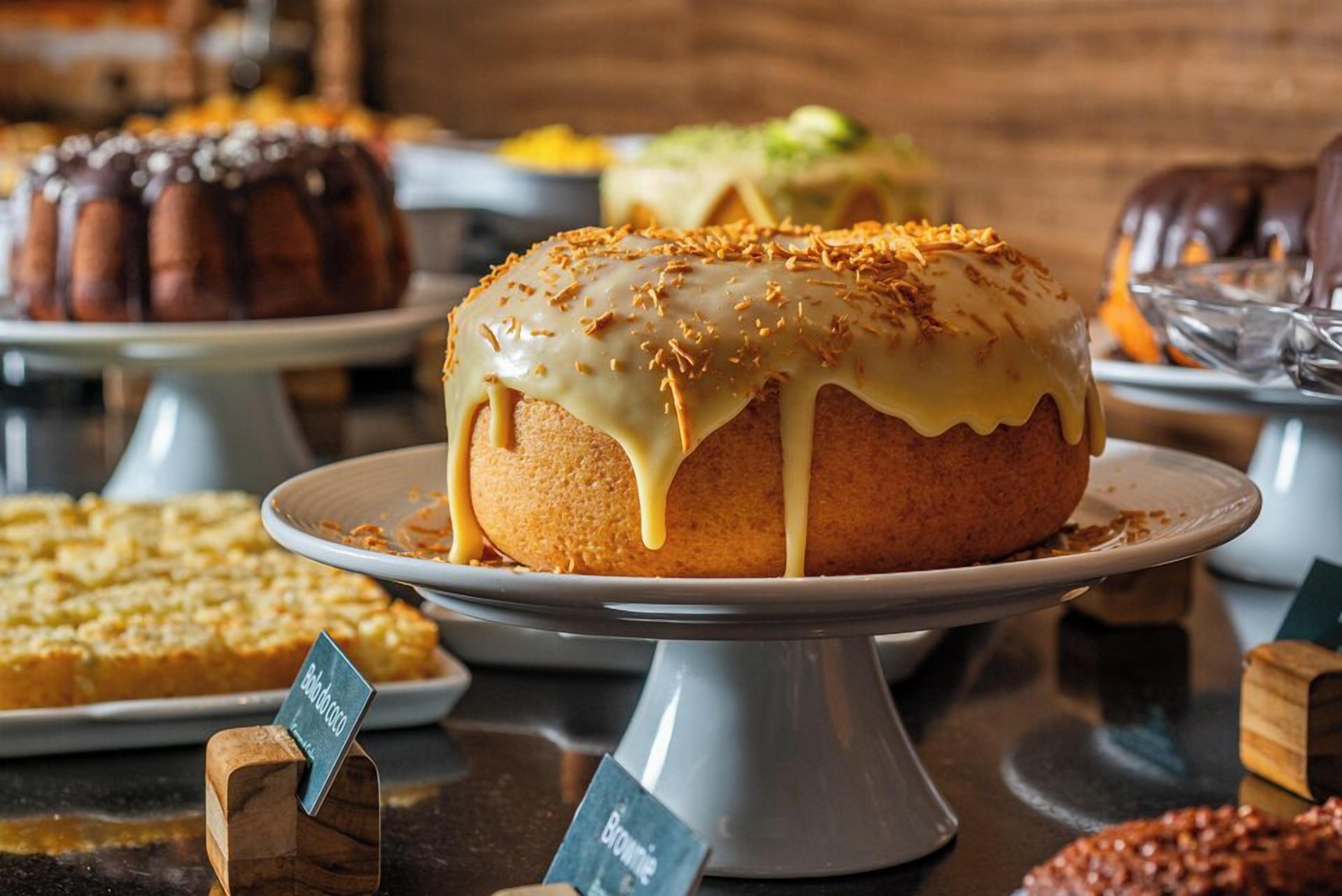 A dessert display with various cakes and pastries.