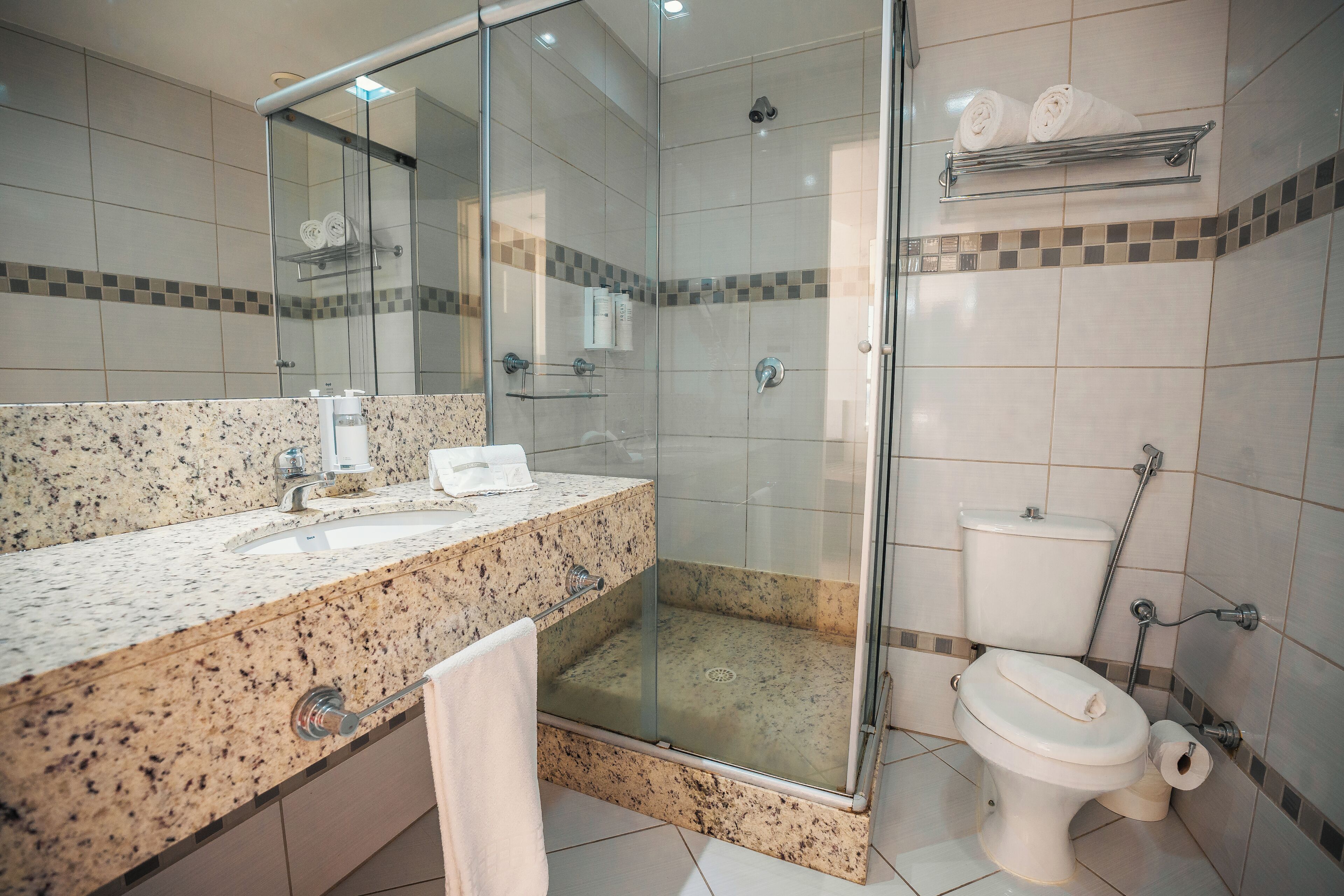 superior room | bathroom | shower, hair dryer, towels