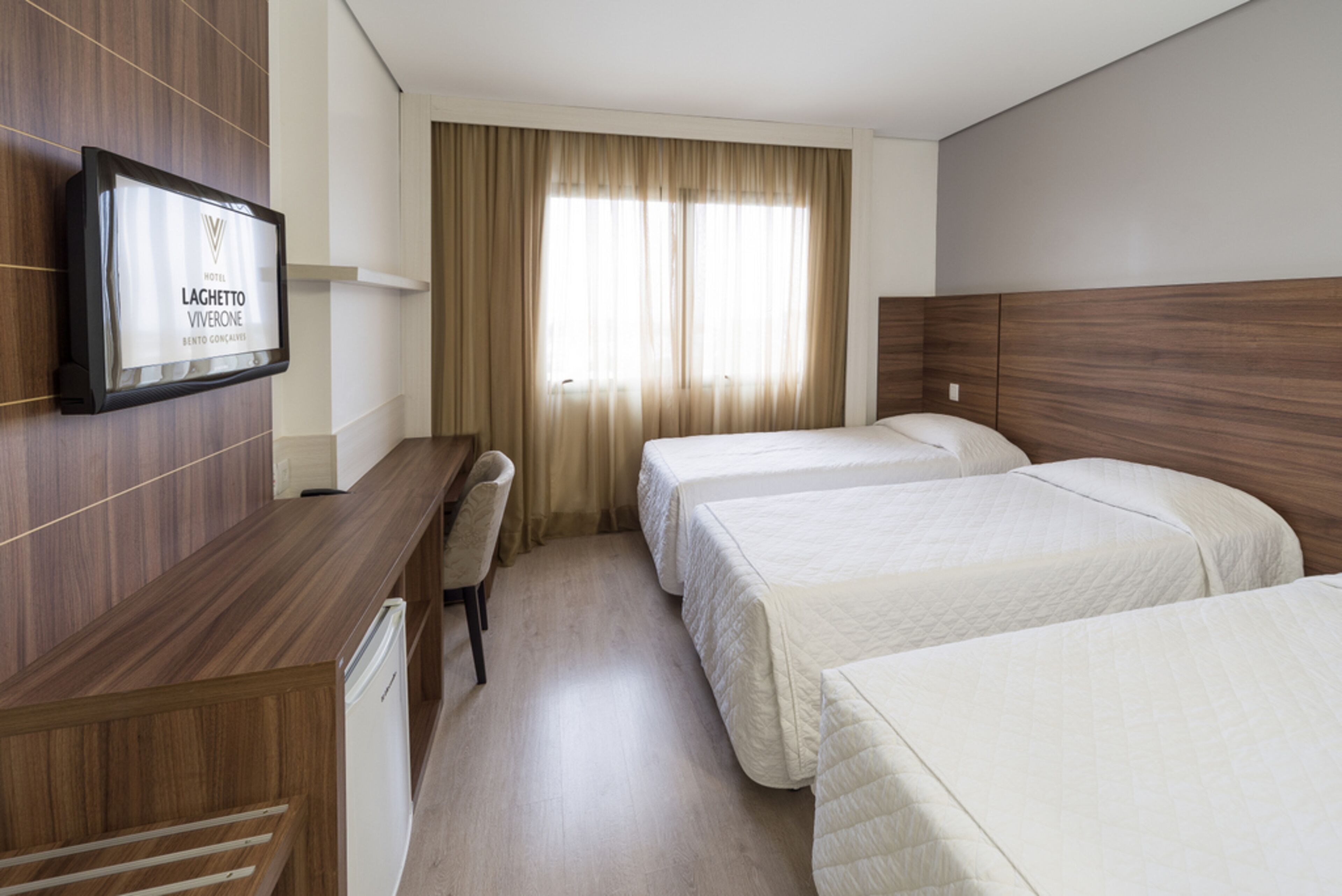 deluxe room | minibar, in-room safe, desk, blackout curtains