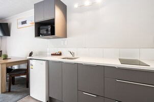 Fridge, microwave, stovetop, coffee/tea maker