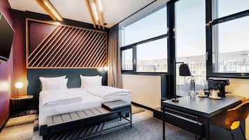 Premium bedding, pillow-top beds, desk, blackout curtains