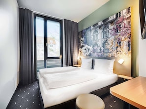 Premium bedding, pillow-top beds, desk, blackout curtains