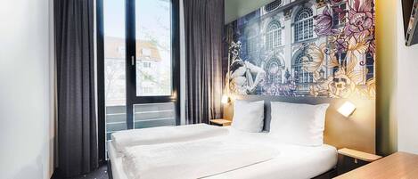 Premium bedding, pillowtop beds, desk, blackout drapes