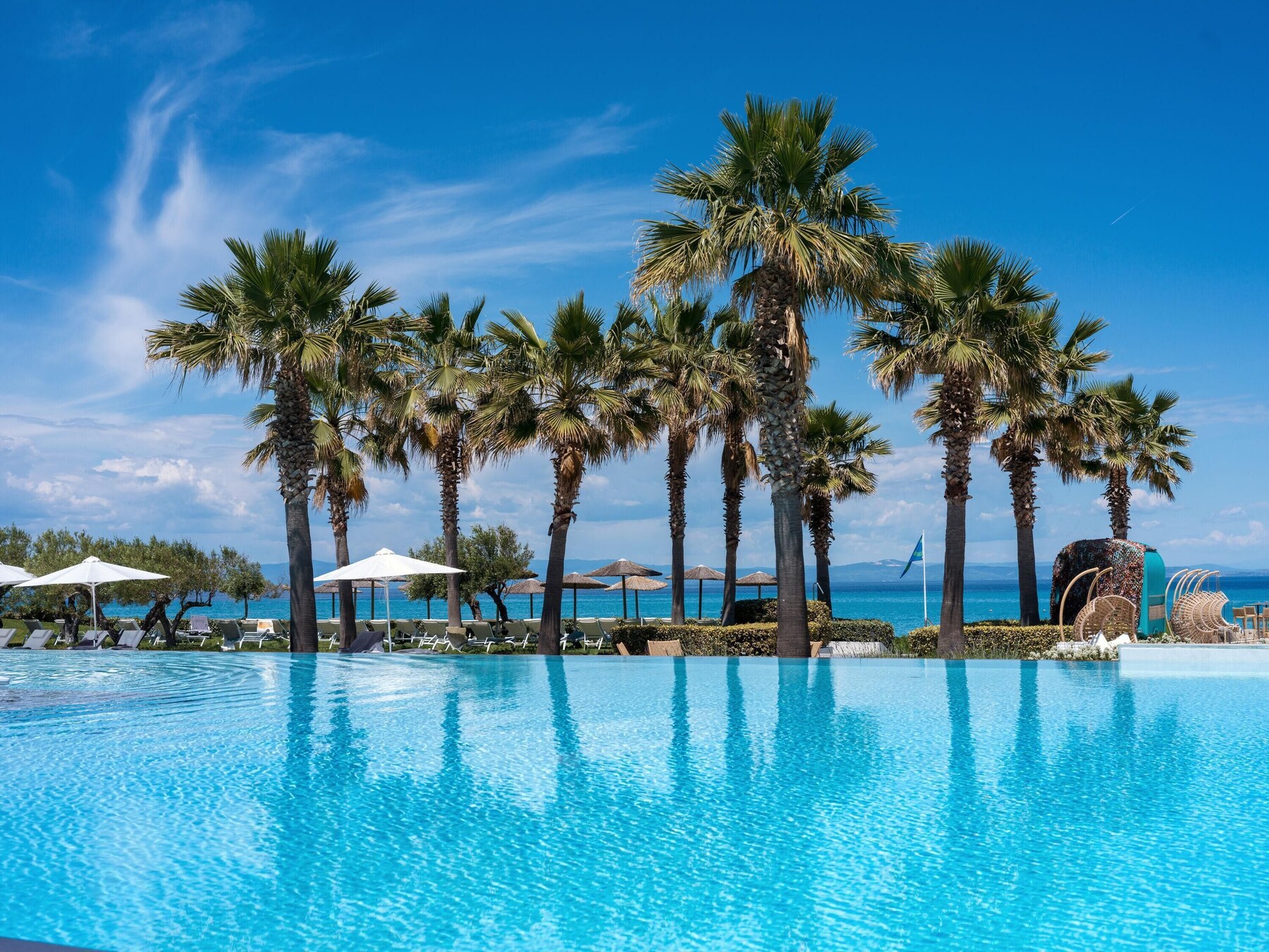 2 outdoor pools, pool umbrellas, pool loungers