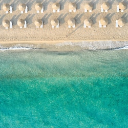 On the beach, sun loungers, beach umbrellas, beach towels