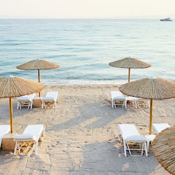 On the beach, sun loungers, beach umbrellas, beach towels