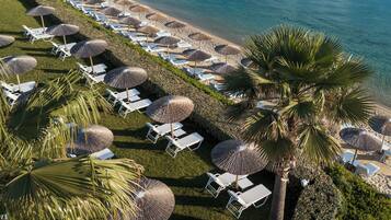 On the beach, sun loungers, beach umbrellas, beach towels
